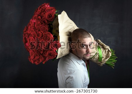 smiling man with big bouquet