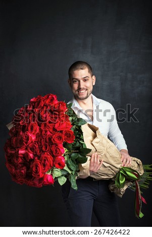 smiling man with big bouquet