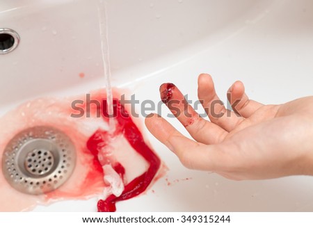 cut finger under the water