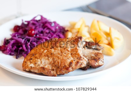 Pork chop with cabbage salad and potatoes