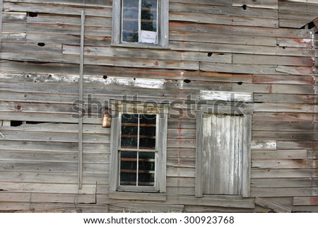 Old and Rustic Abandoned Building Weathered by Time Out in the Country