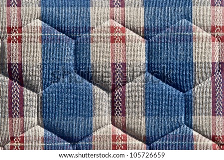 Pattern of retro furniture upholstery texture.Embossed background, grey hexagons, red and blue ornamental bands.