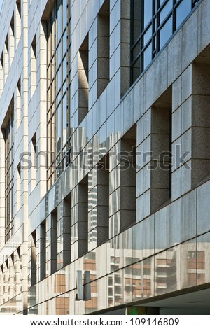 Fragment of a modern building  wall. Metal, concrete, glass, elements of  the \