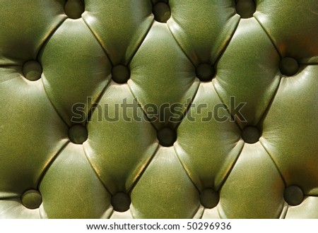 Pattern of the shabby, worn-out dark green  leather furniture upholstery texture
