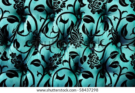 Pattern of a furniture upholstery  tapestry texture.Dark turquoise color with black graphical floral ornament.