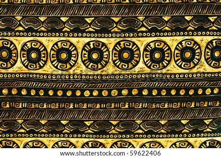 Fragment of decorative carpet fabric pattern in retro style with yellow-black bright geometrical ornament.