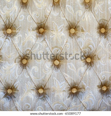 Pattern of a furniture upholstery tapestry texture.Light-beige color with white and dark-beige graphical floral ornament.