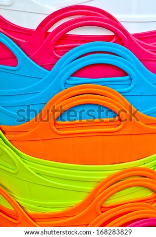 Close up of nested colorful baskets for shopping. Pure and bright colors,ductile lines, smooth surface. Good for background.