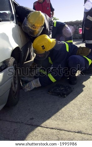 car rescue by firemen