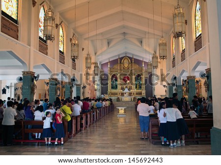 TACLOBAN PHILIPPINES JULY 10 2011 Unidentified Filipinos at Sunday mass in St Joseph Catholic Church on July 10 2011 at Tacloban Philippines Catholicism is the major religion of the country TACLOBAN PHILIPPINES JULY 10 2011 Unidentified Filipinos at Sunday mass in St Joseph Catholic Church on July 10 2011 at Tacloban Philippines Catholicism is the major religion of the country