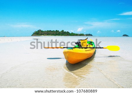 Yellow kayaks on the beach. CHANG ISLAND,THAILAND