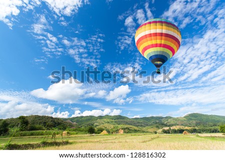 Hot air balloon over the field