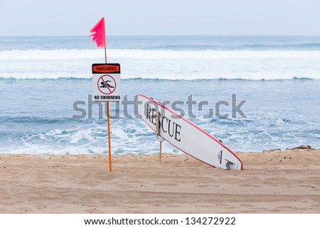Warning no swimming sign with strong sea wave by the beach background