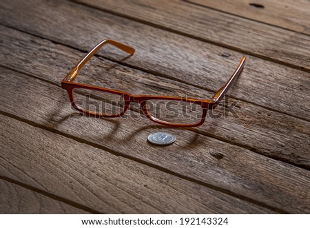 reading eyeglasses on old wooden background