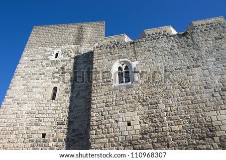a mullioned window in the fortified walls of the Norman-Swabian Castle in the old town of Bari a mullioned window in the fortified walls of the Norman-Swabian Castle in the old town of Bari