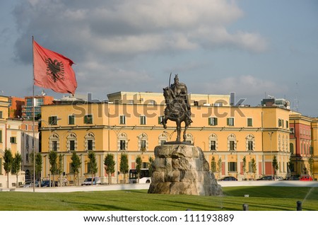 in the square dedicated to the national hero Skanderbeg dominates its equestrian statue and waving Albanian flag - Tirana