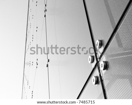 Abstract blue glass of window of panels, black and white