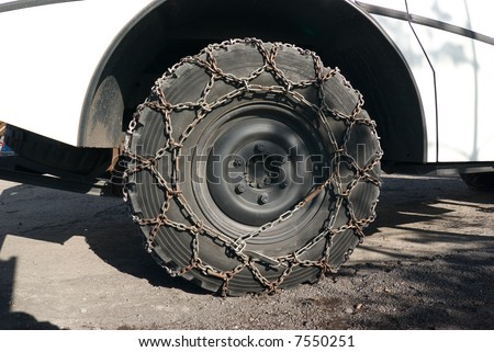 Big tire of truck with the chain for snow and icy