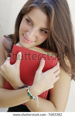 Girl student hug her book