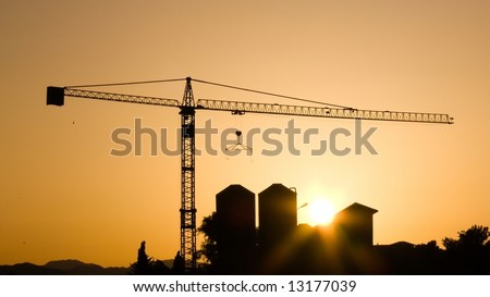 Crane for construction industry at sunset