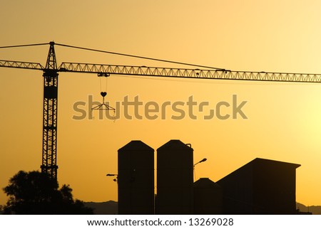Crane for construction industry at sunset