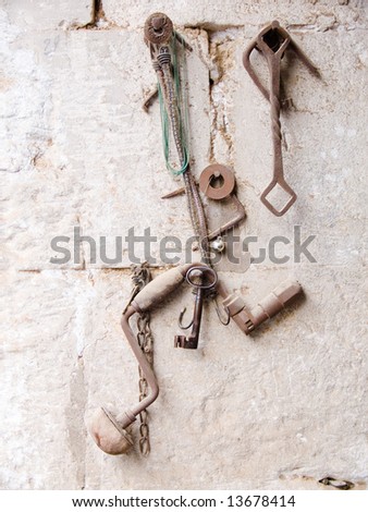kit of old tool on the wall