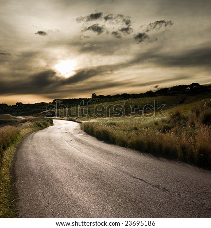 road in middle of rural area to evening