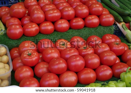well ordered red tomatoes raws at the market