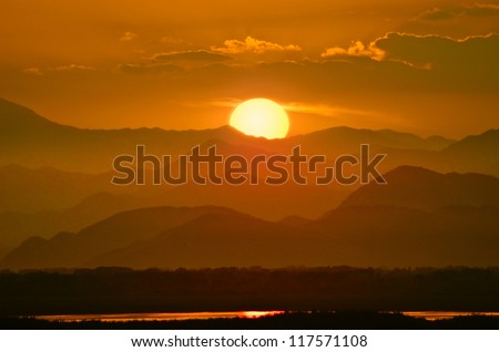 red sunset on the mountain ranges around Lake Skadar, Albania