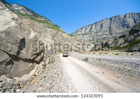 off-road car on dirt road into Cemi Canyon between Tamare and Selce, Kelmend Valley - Albania