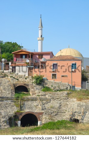ruins of roman amphitheatre and minaret in Durres, Albania