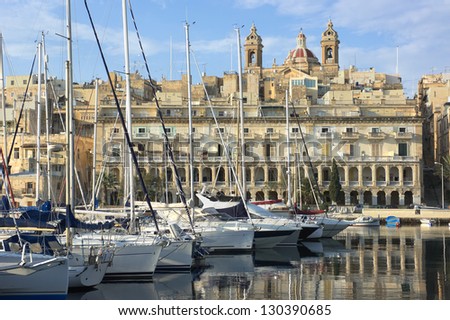 moored sailboats and waterfront of Senglea marina in front Vittoriosa, Malta