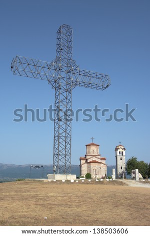 giant metal structure in the shape of a cross over the orthodox church of Sveti Petar i Pavle in Podmocani, Macedonia Republic