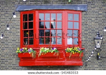 red wooden window georgian style on brickwall of Southwark, London