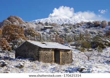 rural area under Etna volcano covered by snow, Sicily