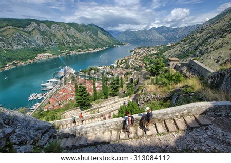 KOTOR, MONTENEGRO - JULY 14: tourists down the stairs from the St. John fortification lead to the bay of Kotor, often named as the southernmost fjord in Europe. Shot in 2014