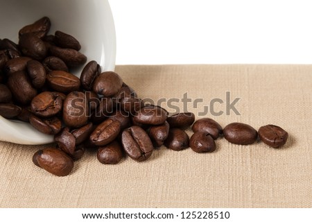 inverted coffe cup with beans, can be used as a background