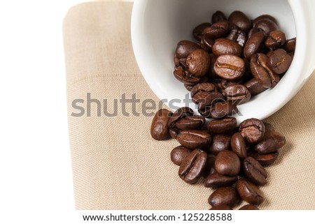 inverted coffee cup with beans, can be used as a background