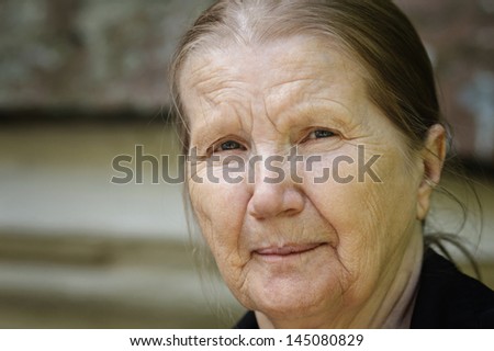 senior woman outdoor portrait, close horizontal orientation