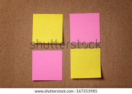 four reminder sticky notes on cork board, empty space for text