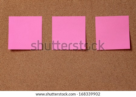 three reminder sticky notes on cork board, empty space for text