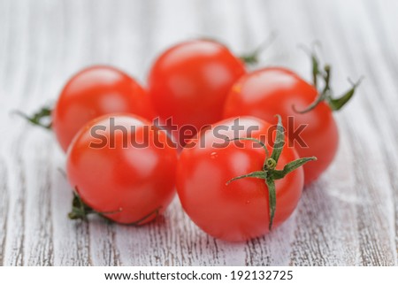 cherry tomatoes on white painted wood table, selective focus