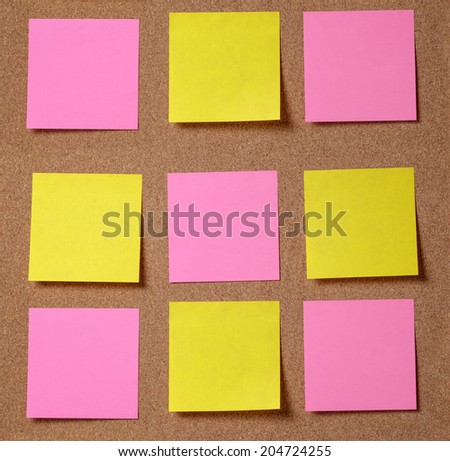 sticky notes on cork board, 3 by 3 square