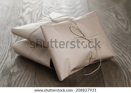 vintage style parcels wrapped with rope, on old oak table