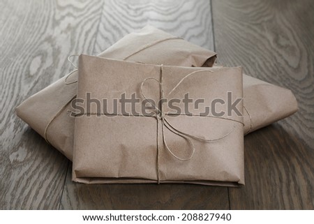 vintage style parcels wrapped with rope, on old oak table