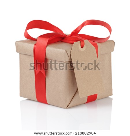 gift box wrapped with kraft paper and red bow with tag for text isolated gift box wrapped with kraft paper and red bow with tag for text isolated
