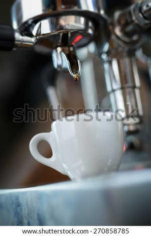 preparing espresso on professional coffee machine