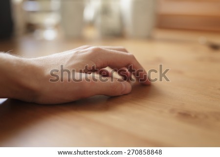 man hand on empty  wood table