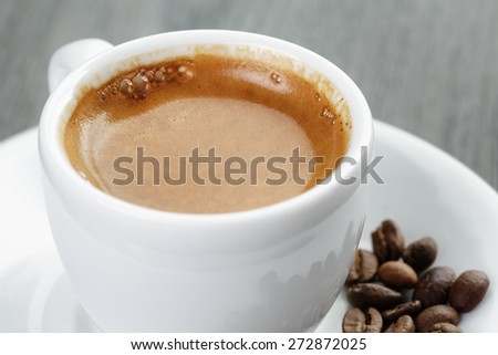 cup of fresh espresso on vintage blue table