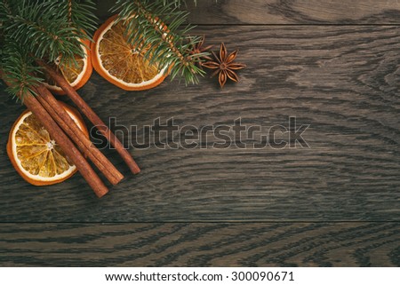 christmas decorations on old oak table, rustic background